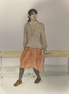 セーターの女性